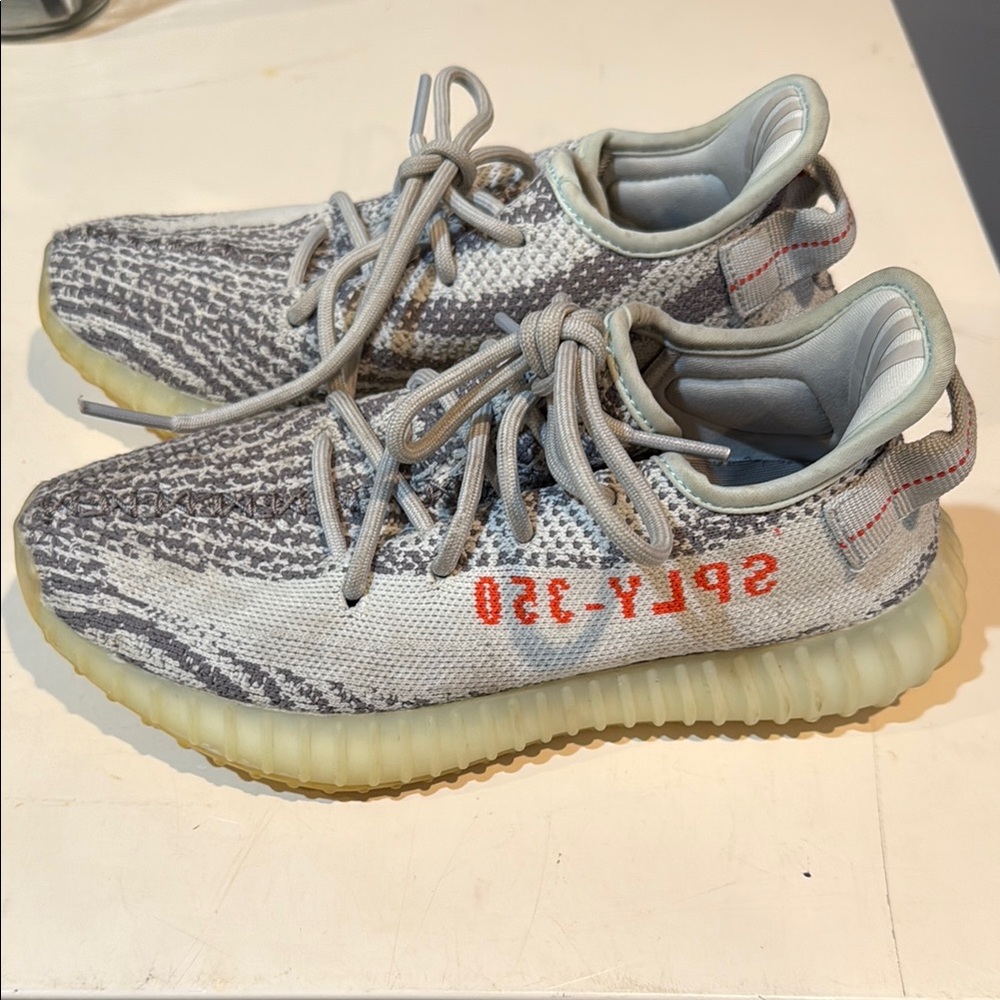 Yeezy Gray and Red Sneakers with Boost Cushioning